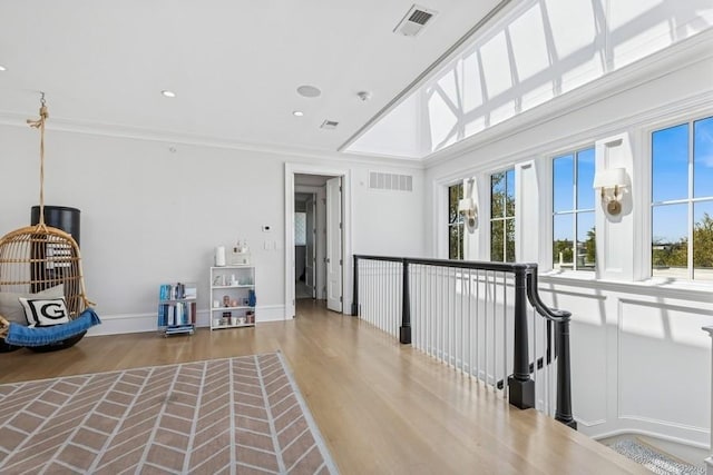 1855 N Hermitage Ave, Chicago, IL 60622 - hall featuring wood finished floors, baseboards, recessed lighting, ornamental molding, and an upstairs landing