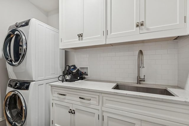 1855 N Hermitage Ave, Chicago, IL 60622 - washroom with estacked washer and dryer and cabinet space