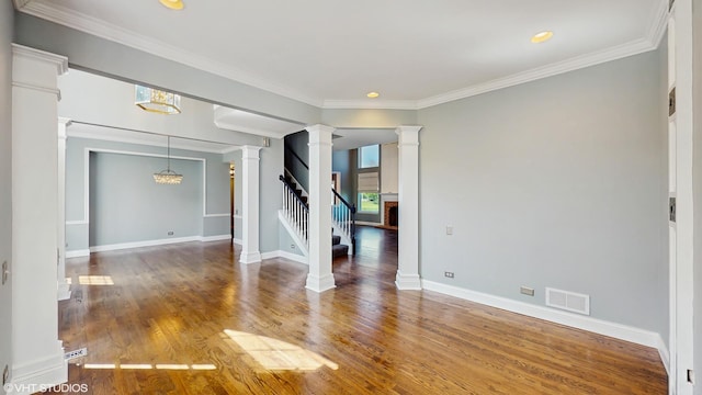 8 Georgetown Ct, Algonquin, IL 60102 - unfurnished room featuring decorative columns, wood finished floors, baseboards, stairway, and ornamental molding