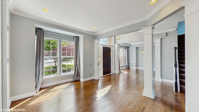 8 Georgetown Ct, Algonquin, IL 60102 - foyer featuring decorative columns, ornamental molding, baseboards, wood finished floors, and recessed lighting