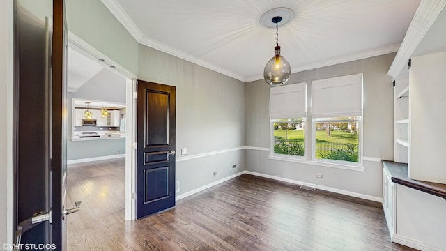 8 Georgetown Ct, Algonquin, IL 60102 - unfurnished dining area featuring crown molding, wood finished floors, and baseboards