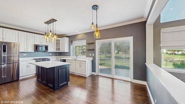8 Georgetown Ct, Algonquin, IL 60102 - kitchen with appliances with stainless steel finishes, white cabinets, light countertops, a sink, and glass insert cabinets