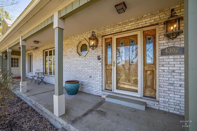 4302 Fox Creek Dr, Crystal Lake, IL 60012 - property entrance featuring covered porch and brick siding