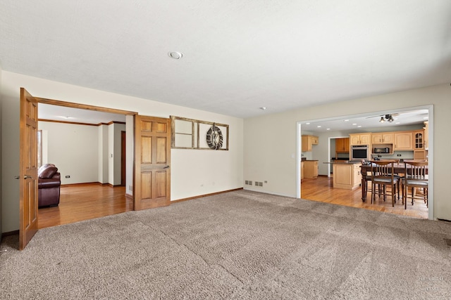 4302 Fox Creek Dr, Crystal Lake, IL 60012 - living area featuring light carpet, baseboards, and recessed lighting