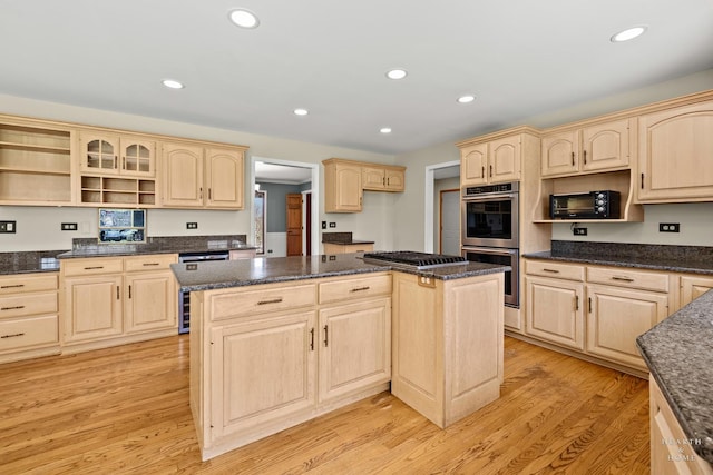 4302 Fox Creek Dr, Crystal Lake, IL 60012 - kitchen featuring light brown cabinets, stainless steel appliances, open shelves, a center island, and light wood-type flooring