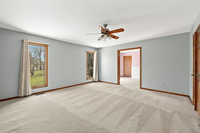 4302 Fox Creek Dr, Crystal Lake, IL 60012 - unfurnished room with a ceiling fan, baseboards, and light carpet