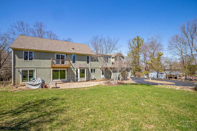 4302 Fox Creek Dr, Crystal Lake, IL 60012 - rear view of house featuring a yard, a balcony, and roof with shingles