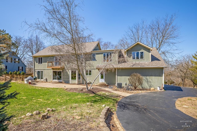 4302 Fox Creek Dr, Crystal Lake, IL 60012 - view of front of home with a front lawn, a balcony, and roof with shingles