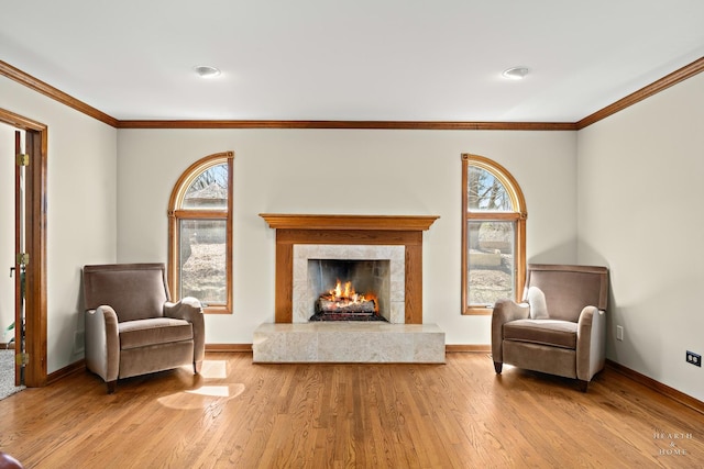 4302 Fox Creek Dr, Crystal Lake, IL 60012 - living area featuring wood finished floors, crown molding, baseboards, and a fireplace