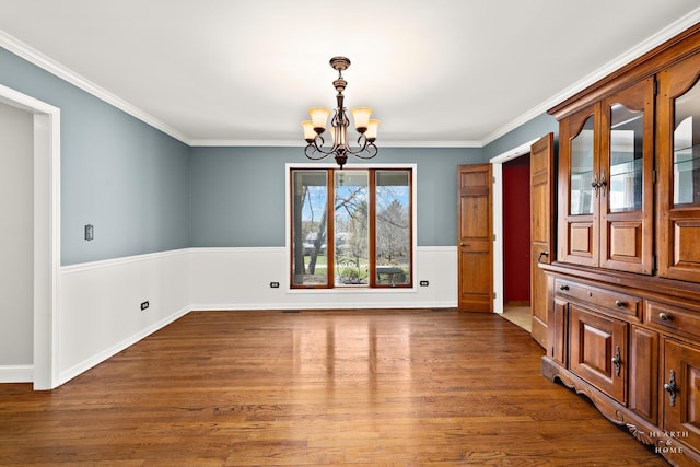 4302 Fox Creek Dr, Crystal Lake, IL 60012 - unfurnished dining area featuring a chandelier, dark wood-style flooring, and crown molding