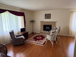 75 6th Ave Unit 209, La Grange, IL 60525 - living room featuring wood finished floors and a fireplace