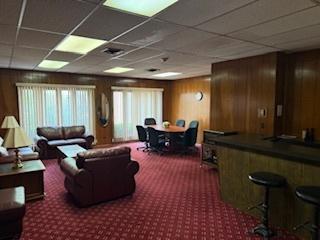 75 6th Ave Unit 209, La Grange, IL 60525 - misc room with carpet, wooden walls, and a drop ceiling