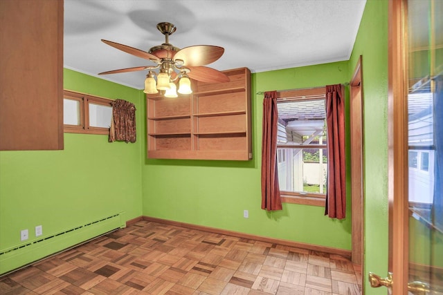 2109 Grange Dr, Urbana, IL 61801 - spare room featuring baseboard heating and a ceiling fan