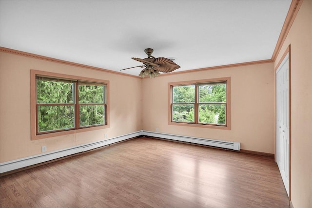 2109 Grange Dr, Urbana, IL 61801 - unfurnished room featuring a baseboard heating unit, crown molding, wood finished floors, and ceiling fan