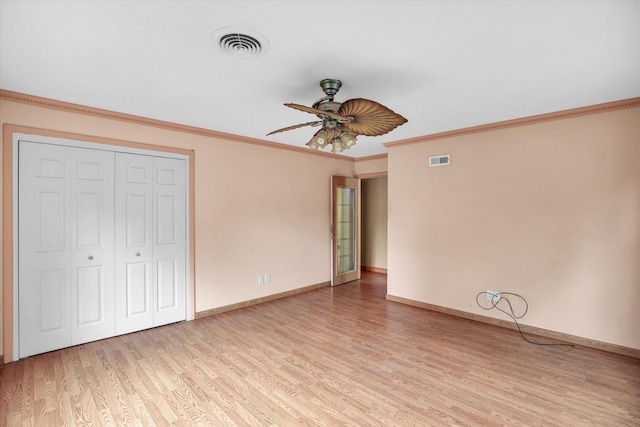 2109 Grange Dr, Urbana, IL 61801 - unfurnished bedroom featuring light wood-style floors, crown molding, a closet, and ceiling fan
