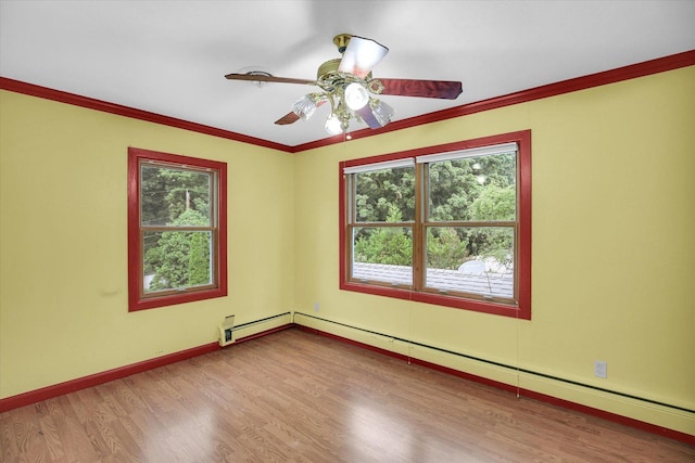 2109 Grange Dr, Urbana, IL 61801 - empty room featuring baseboard heating, wood finished floors, plenty of natural light, and crown molding