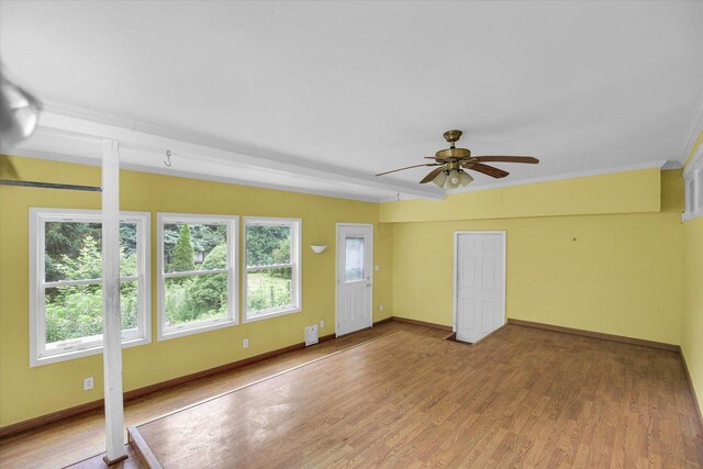 2109 Grange Dr, Urbana, IL 61801 - spare room featuring a ceiling fan, wood finished floors, and ornamental molding