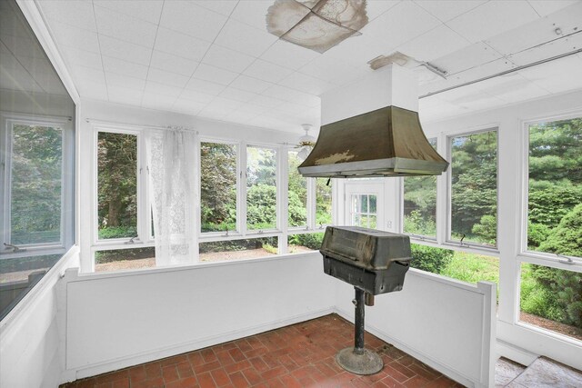 2109 Grange Dr, Urbana, IL 61801 - unfurnished sunroom featuring brick flooring