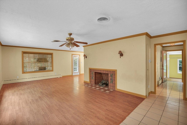 2109 Grange Dr, Urbana, IL 61801 - unfurnished living room with a baseboard radiator, ceiling fan, light wood-style floors, a textured ceiling, and ornamental molding
