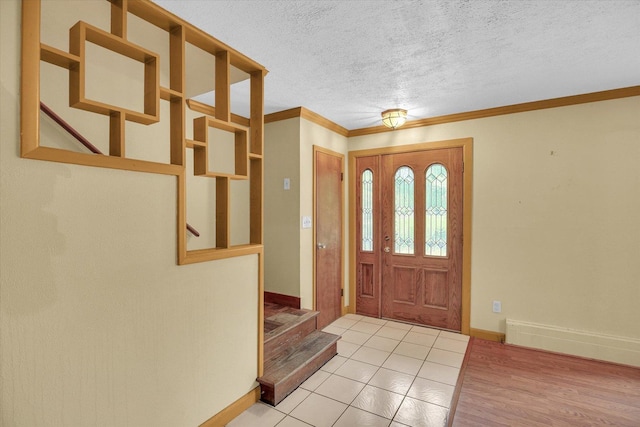 2109 Grange Dr, Urbana, IL 61801 - tiled foyer entrance with stairway, crown molding, and a textured ceiling