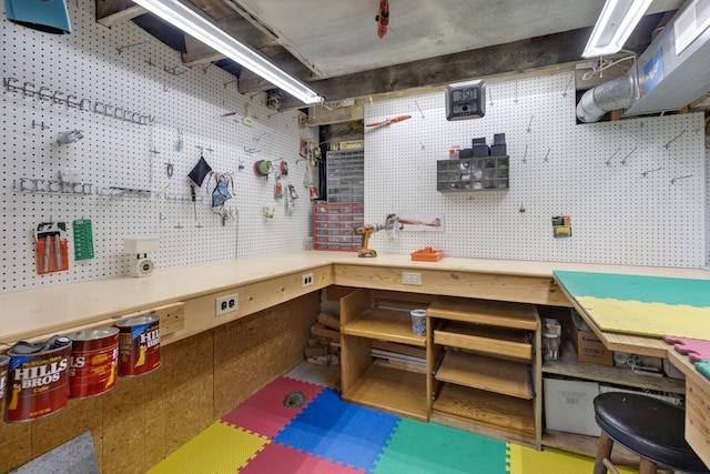 basement with a workshop area