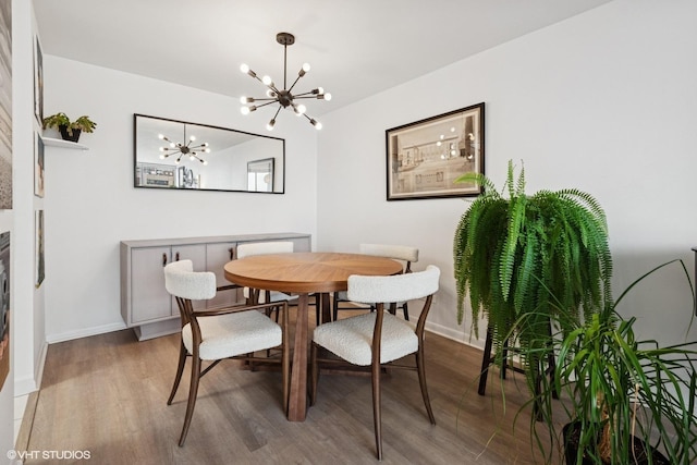 6171 N Sheridan Rd Unit 2704, Chicago, IL 60660 - dining room featuring a chandelier, wood finished floors, and baseboards