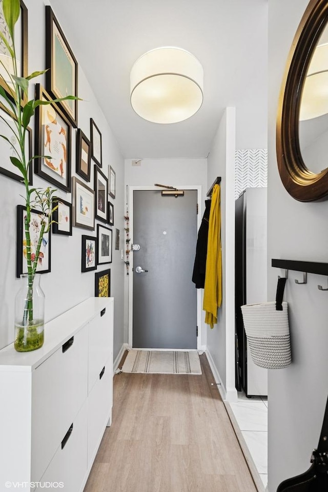 6171 N Sheridan Rd Unit 2704, Chicago, IL 60660 - mudroom featuring light wood-style floors and baseboards