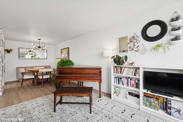 6171 N Sheridan Rd Unit 2704, Chicago, IL 60660 - sitting room featuring wood finished floors, a chandelier, and baseboards