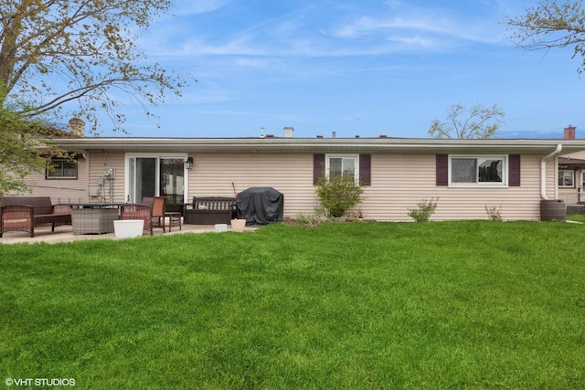 1313 S Elizabeth St, Lombard, IL 60148 - back of house featuring an outdoor living space, a yard, a patio area, and a chimney