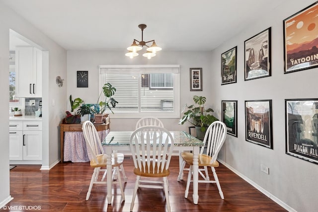 1313 S Elizabeth St, Lombard, IL 60148 - dining room featuring a chandelier, dark wood finished floors, plenty of natural light, and baseboards