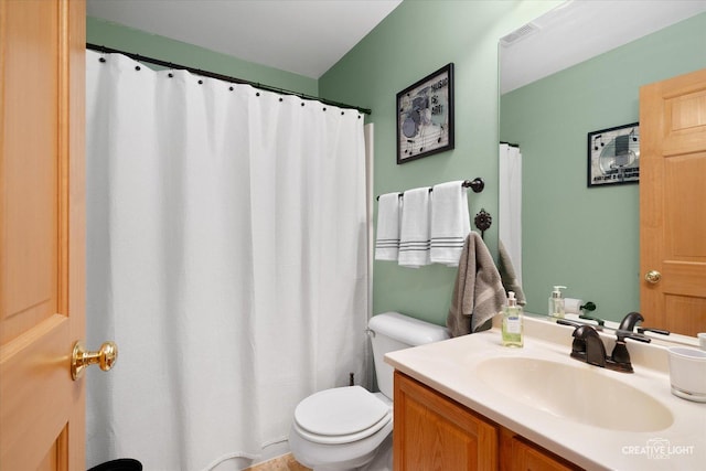 bathroom featuring toilet and vanity