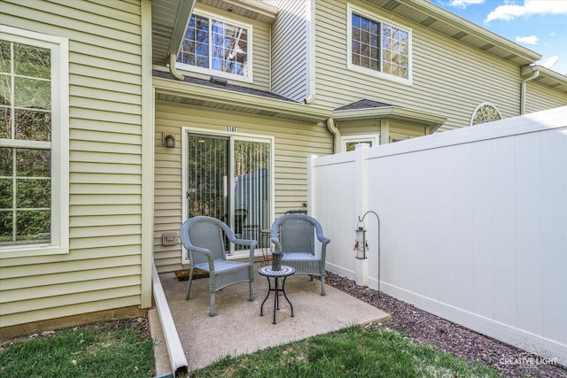 view of patio / terrace featuring fence