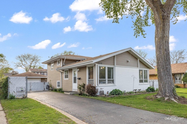 1020 Hahn Pl, West Chicago, IL 60185 - tri-level home featuring a detached garage and brick siding