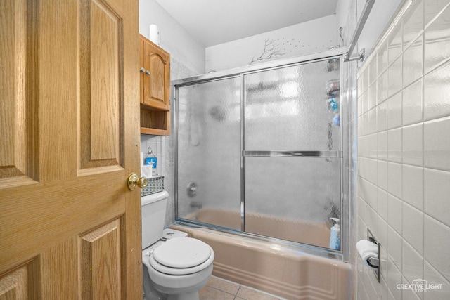 1020 Hahn Pl, West Chicago, IL 60185 - bathroom with enclosed tub / shower combo, toilet, and tile patterned flooring