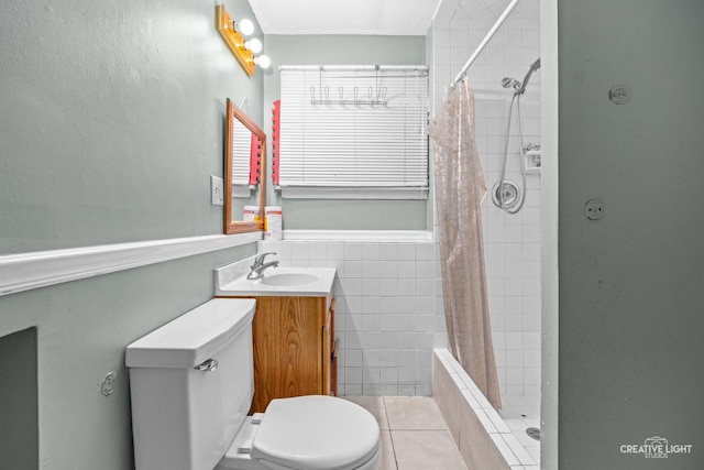 1020 Hahn Pl, West Chicago, IL 60185 - bathroom featuring toilet, a sink, a tile shower, tile patterned flooring, and tile walls