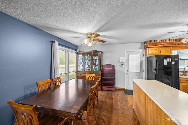1020 Hahn Pl, West Chicago, IL 60185 - dining area with ceiling fan, dark wood finished floors, a textured ceiling, and baseboards