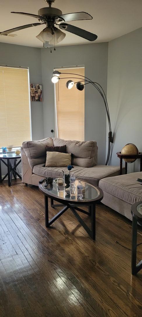 7542 S Peoria St, Chicago, IL 60620 - living area with a ceiling fan and wood-type flooring