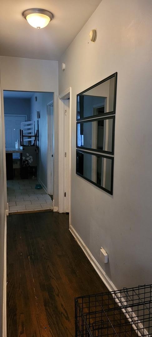 7542 S Peoria St, Chicago, IL 60620 - hallway with hardwood / wood-style floors and baseboards