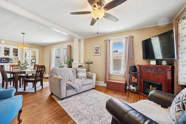 1009 W Madison St, Ottawa, IL 61350 - living area with ceiling fan, a fireplace, wood finished floors, and baseboards