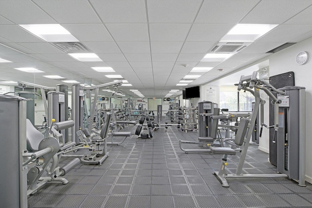 workout area with a paneled ceiling