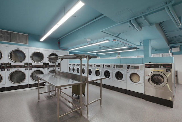 shared laundry room with stacked washer / drying machine and washer and dryer