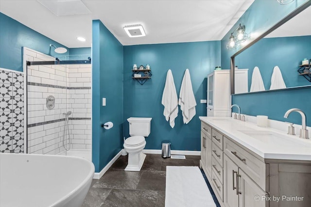 bathroom with a shower stall, double vanity, a freestanding tub, and baseboards