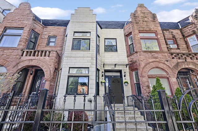 4738 S Champlain Ave, Chicago, IL 60615 - townhome / multi-family property with a fenced front yard and a gate