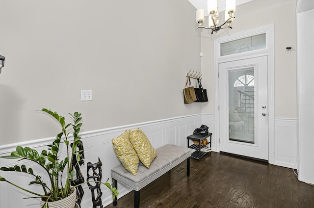 4738 S Champlain Ave, Chicago, IL 60615 - entrance foyer featuring a chandelier, a wainscoted wall, and dark wood-style flooring