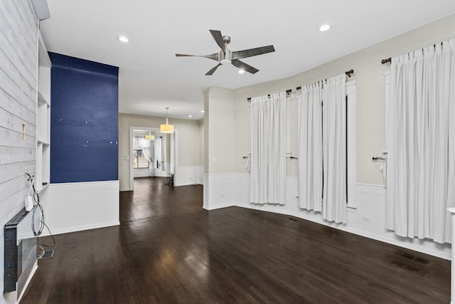 4738 S Champlain Ave, Chicago, IL 60615 - unfurnished living room with a ceiling fan, wainscoting, wood finished floors, a large fireplace, and recessed lighting