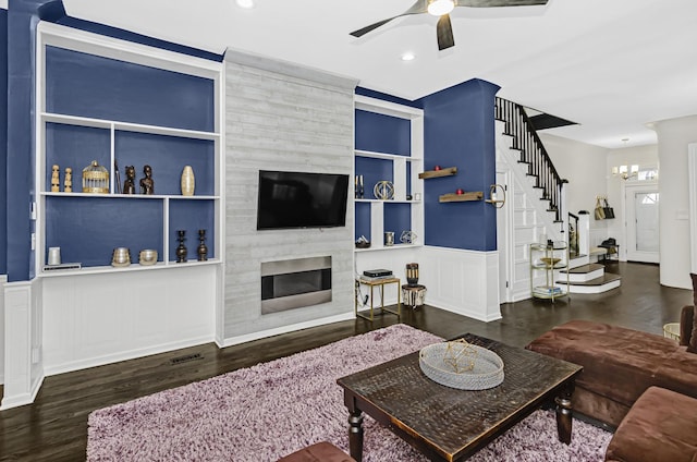 4738 S Champlain Ave, Chicago, IL 60615 - living area featuring stairway, a ceiling fan, a decorative wall, built in features, and a chandelier