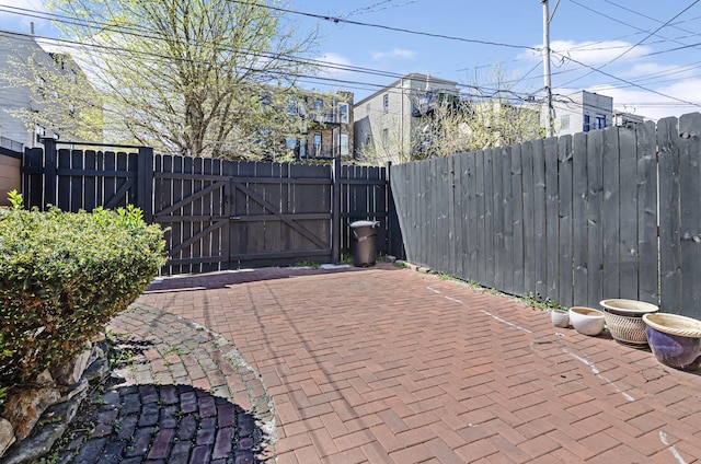 4738 S Champlain Ave, Chicago, IL 60615 - view of patio with a gate and fence