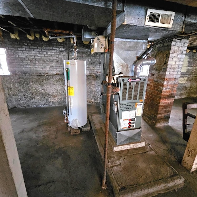utility room featuring gas water heater