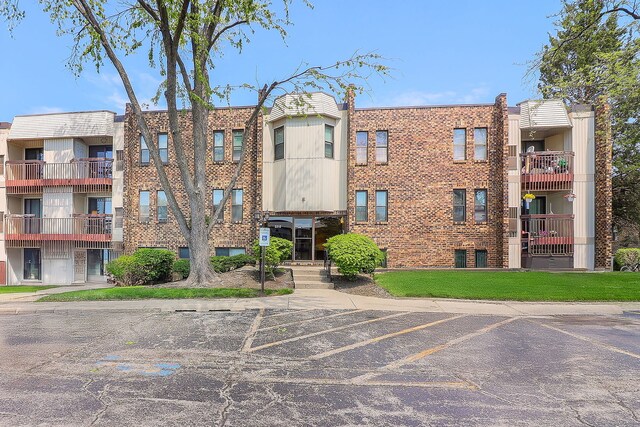 2212 Country Club Dr Unit 2, Woodridge, IL 60517 - view of building exterior with uncovered parking