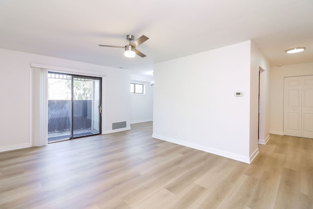 2212 Country Club Dr Unit 2, Woodridge, IL 60517 - unfurnished room featuring light wood-type flooring, a ceiling fan, and baseboards